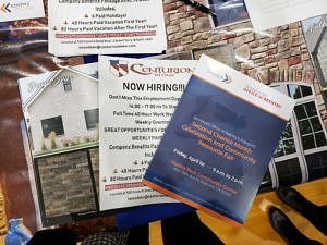 Photo of handouts, booklets, and other resources fanned out on a table