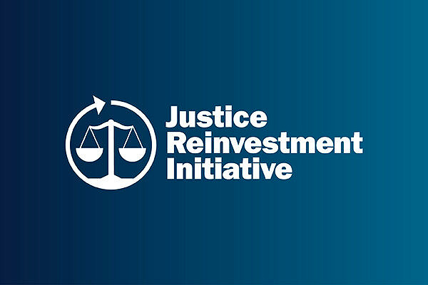 Justice Reinvestment Initiative Logo against a blue gradient background