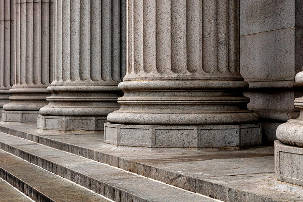 Stone colonnade and stairs detail. Classical pillars row in a building facade